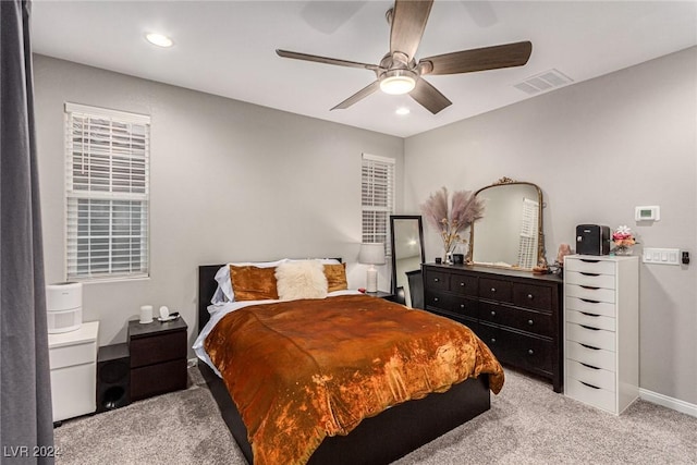 carpeted bedroom with ceiling fan