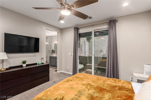 carpeted bedroom featuring ceiling fan, ensuite bath, and access to exterior