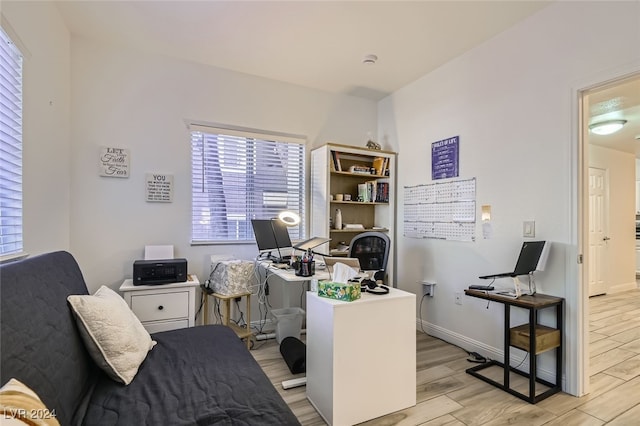 office space with light hardwood / wood-style floors