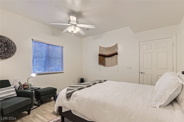 bedroom featuring hardwood / wood-style flooring and ceiling fan