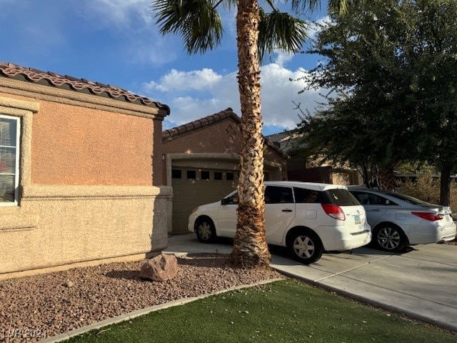 view of side of property featuring a garage