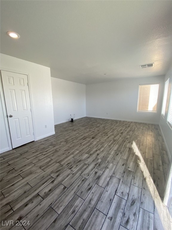 spare room with wood-type flooring