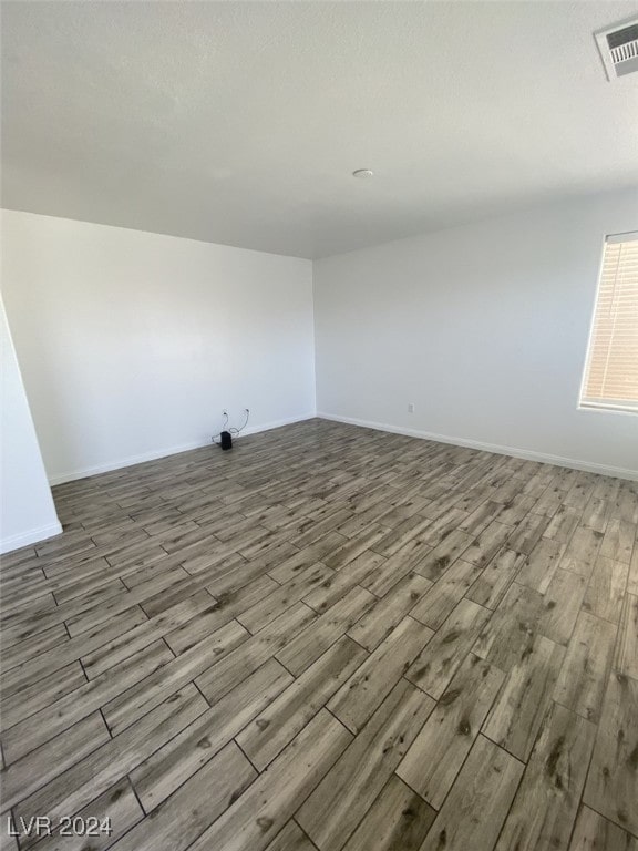 unfurnished room featuring light hardwood / wood-style flooring