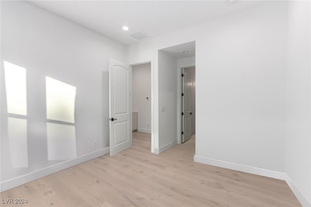 unfurnished room featuring light hardwood / wood-style flooring