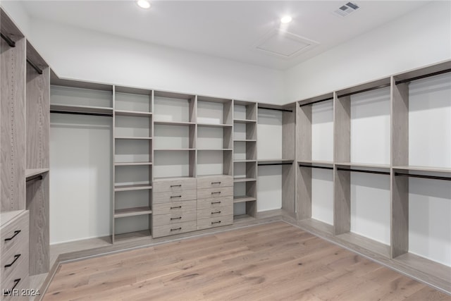 spacious closet featuring light hardwood / wood-style flooring