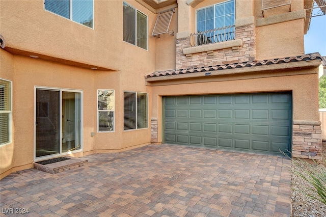 exterior space featuring decorative driveway