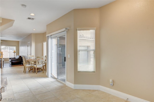 interior space featuring light tile patterned floors, visible vents, baseboards, and recessed lighting