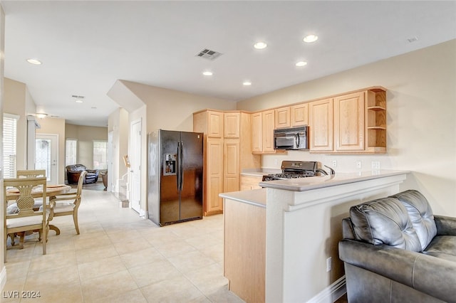 kitchen featuring visible vents, recessed lighting, light brown cabinetry, black appliances, and open floor plan