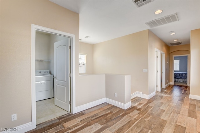 interior space featuring visible vents, light wood-style floors, and washer / dryer