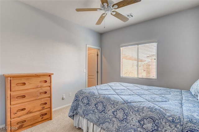 carpeted bedroom featuring a ceiling fan, baseboards, and visible vents