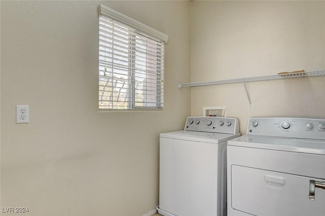 clothes washing area featuring laundry area and washer and dryer