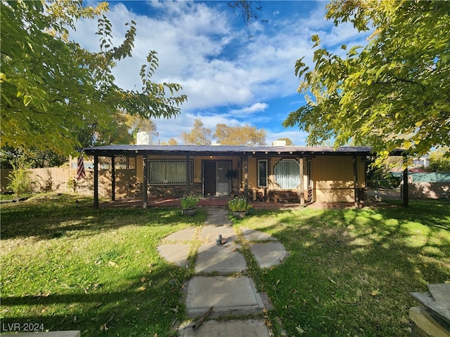 ranch-style home featuring a front yard and a porch