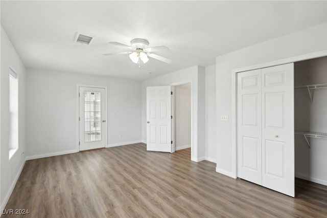 unfurnished bedroom featuring ceiling fan and wood-type flooring