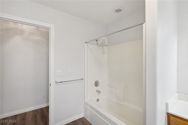 bathroom with vanity,  shower combination, and wood-type flooring