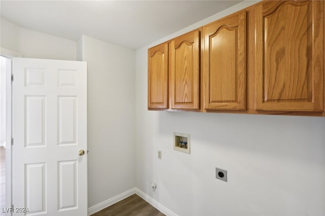 washroom with cabinets, washer hookup, dark wood-type flooring, and electric dryer hookup