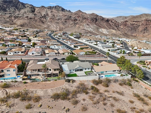 birds eye view of property featuring a mountain view