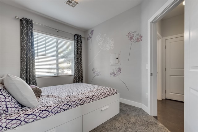 bedroom with visible vents and baseboards