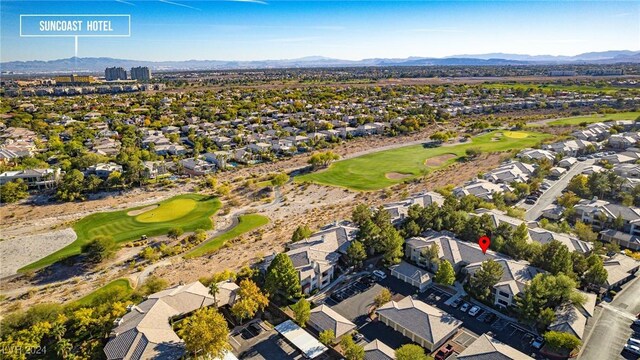 birds eye view of property with golf course view, a residential view, and a mountain view