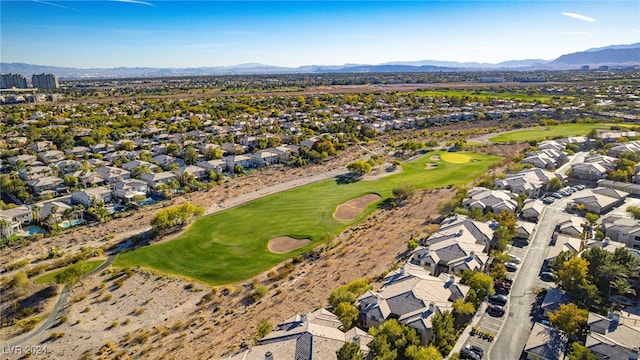 birds eye view of property with a residential view, a mountain view, and golf course view