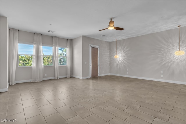 spare room featuring ceiling fan