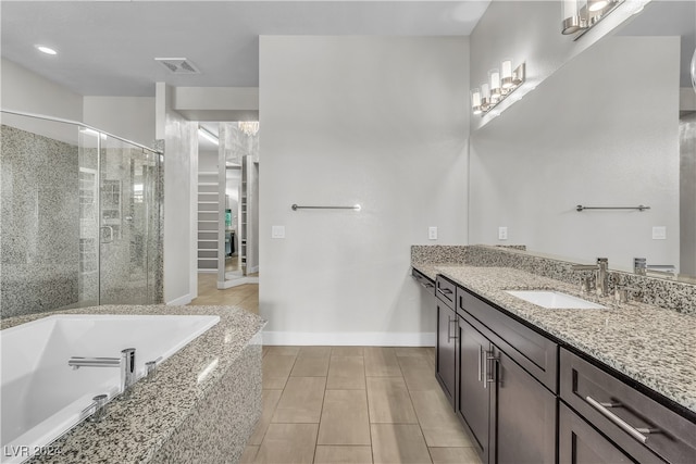 bathroom featuring tile patterned flooring, vanity, and independent shower and bath