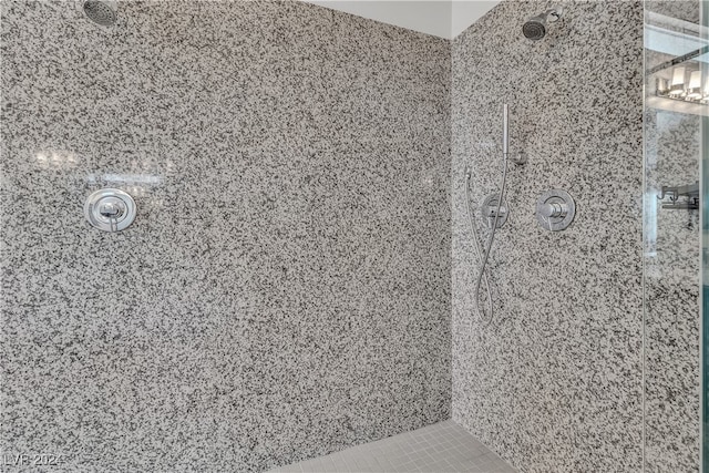 bathroom with a tile shower