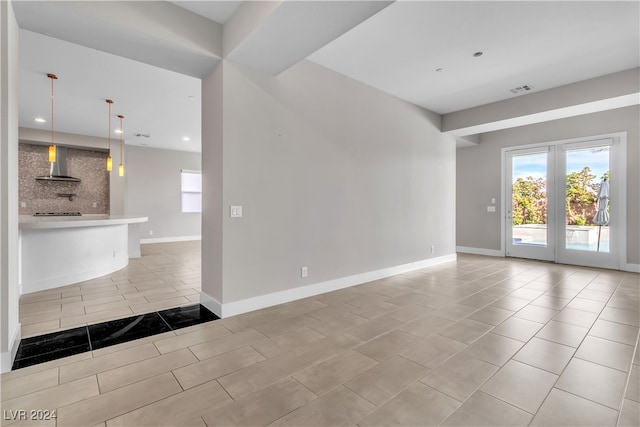 interior space with french doors and light tile patterned flooring