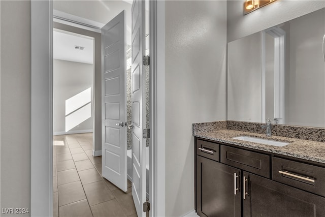 bathroom featuring tile patterned floors and vanity