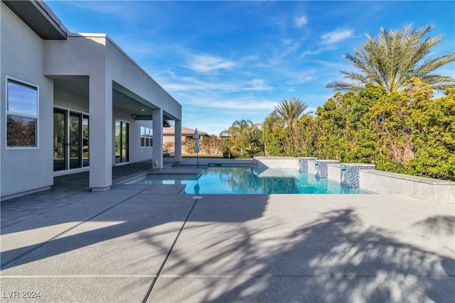 view of pool featuring a patio