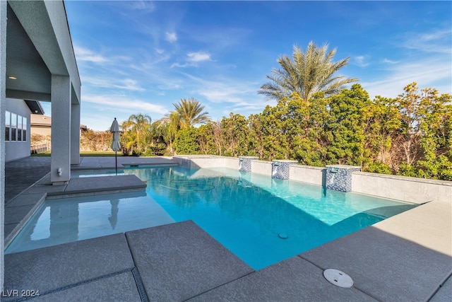 view of pool featuring a patio