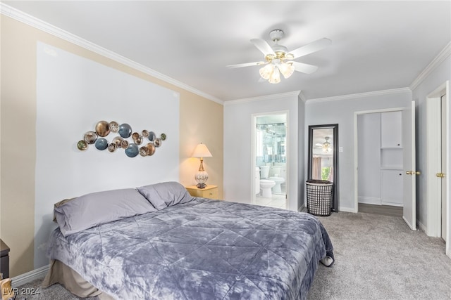 carpeted bedroom with ceiling fan, ornamental molding, and connected bathroom