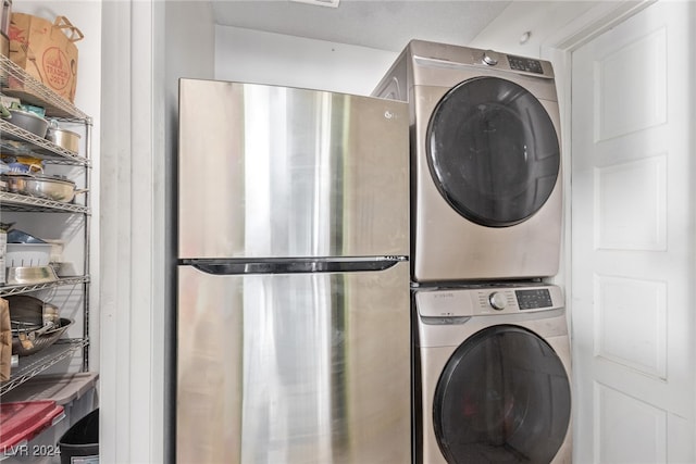 laundry area featuring stacked washer / dryer