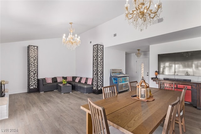 dining room featuring light hardwood / wood-style flooring and a chandelier