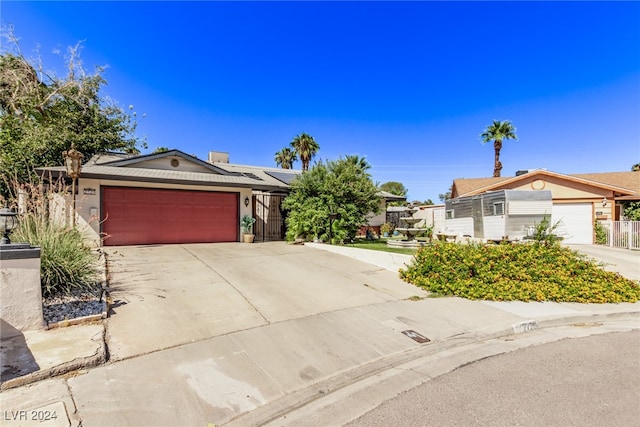 ranch-style home featuring a garage