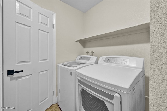 clothes washing area featuring washing machine and dryer