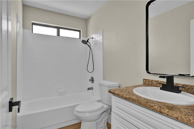 full bathroom with vanity, toilet, and tiled shower / bath