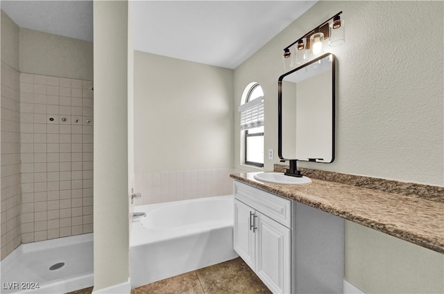 bathroom featuring tile patterned flooring, vanity, and independent shower and bath