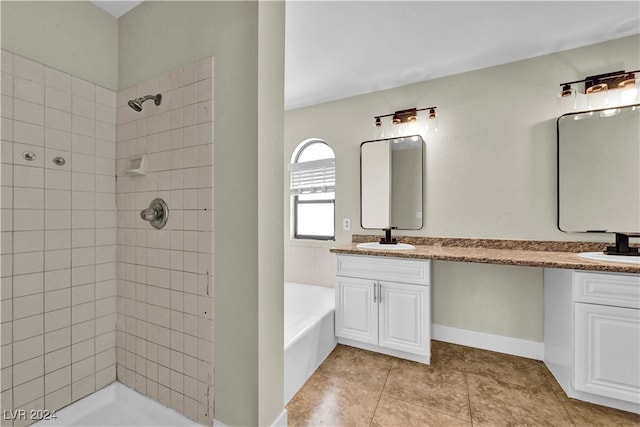 bathroom featuring plus walk in shower, tile patterned flooring, and vanity