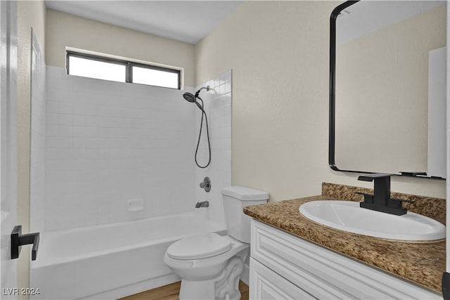 full bathroom featuring wood-type flooring, vanity, toilet, and tiled shower / bath