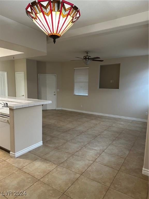 1404 Seward St Unit 104, Las Vegas, NV 89128 - empty room with light tile patterned flooring and a ceiling fan