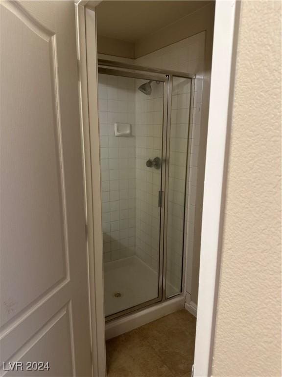 1404 Seward St Unit 104, Las Vegas, NV 89128 - bathroom with a stall shower and tile patterned flooring