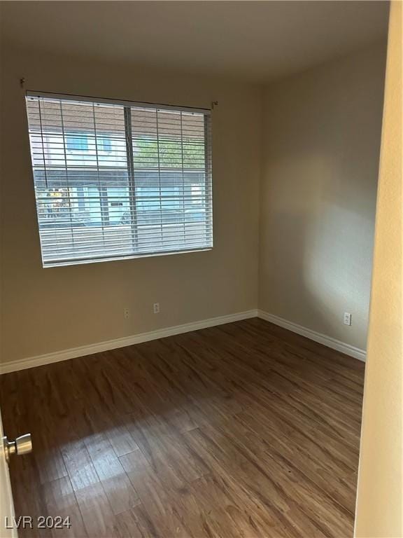 1404 Seward St Unit 104, Las Vegas, NV 89128 - empty room with wood finished floors and baseboards