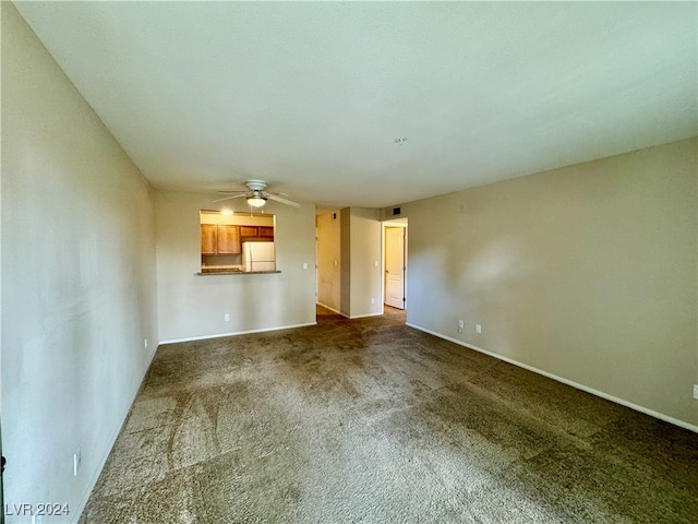 interior space featuring carpet floors and ceiling fan