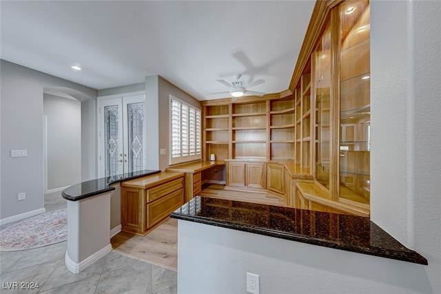 office space with ceiling fan and light tile patterned flooring