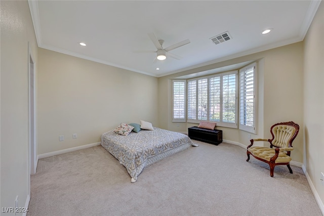 bedroom with light colored carpet, ceiling fan, and crown molding