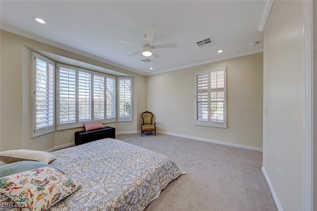 bedroom with ceiling fan, crown molding, light carpet, and multiple windows