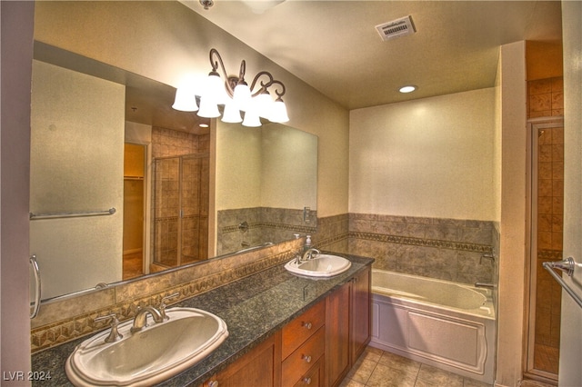 bathroom featuring tile patterned flooring, vanity, and independent shower and bath