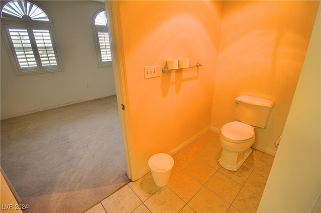 bathroom featuring tile patterned floors and toilet