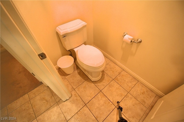 bathroom featuring tile patterned flooring and toilet