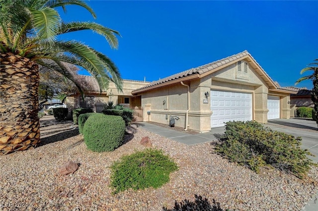 ranch-style house featuring a garage